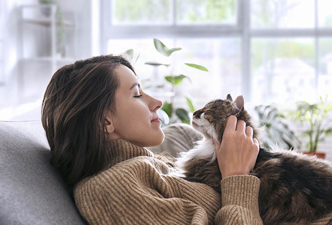 Pet Owner with her cat and dog