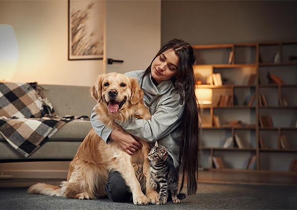 Pet Owner with her cat and dog